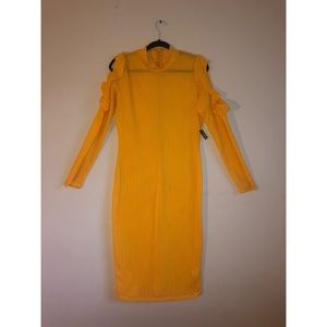 Yellow long sleeve dress. Sleeve shouldercut outs.